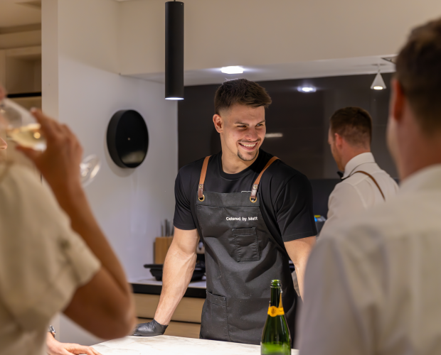 Guests chatting with Chef Matt at a corporate party in Sydney