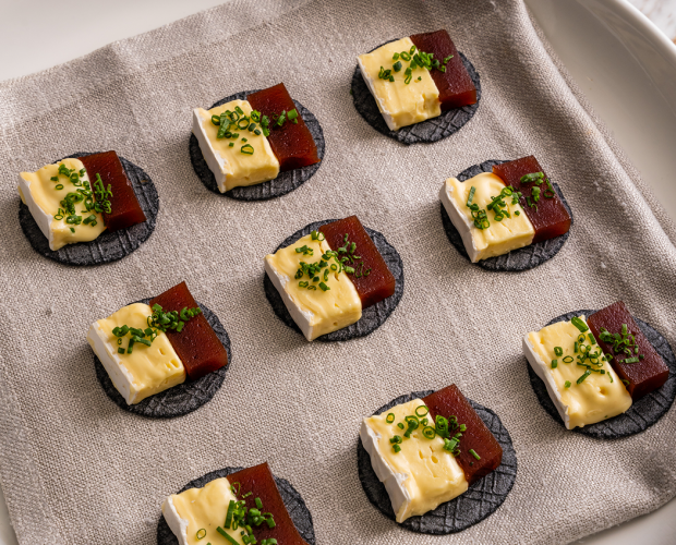 Brie and quince canapés on platter for Tamarama baby shower celebration