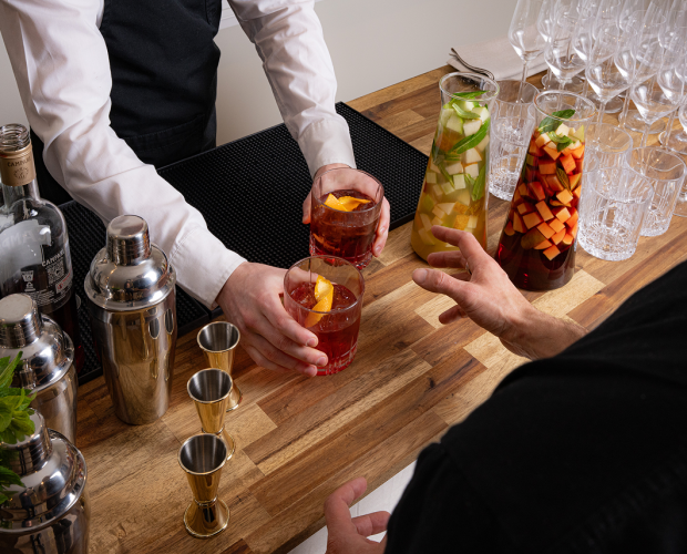 Waiter presenting cocktails during Oxford Street corporate event